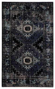 a black and blue rug with an intricate design