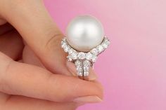 For Sale on 1stDibs - This South Sea pearl and diamond cocktail ring features a top quality pearl of 18.50mm diameter. The pearl is untreated. It displays a splendid nacre and Luxury Fine Jewelry Pearl Ring With Single Diamond, Luxury High Luster Pearl Ring, Luxury Exquisite Pearl Ring With Round Cut, Luxury High Luster Pearl Ring In Silver, Luxury Antique Pearl Ring With Diamond, Sea Rings, Golden South Sea Pearls, Gold Cocktail, Gold Cocktail Ring