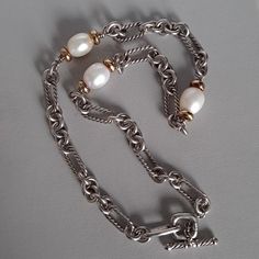 Authentic Vintage David Yurman. Sterling Silver, 18k Gold And Pearl Necklace. The Clasp Is Marked 925 For Silver, 750 For Gold, And Dy For The Brand Logo. Choker Style. Timeless And Classic. Wear With A Crew Neck Sweater Or With A Strapless Dress. Overall In Good Vintage Condition With Nothing Major To Note. Normal Patina That Is Typical Of Sterling Silver Jewelry Over Time. Gold And Pearl Necklace, Yurman Necklace, David Yurman Necklace, Classic Wear, David Yurman Jewelry, Choker Style, David Yurman, Crew Neck Sweater, Neck Sweater