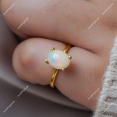 Gemstone : Natural Ethiopian Opal Metal : 9K Gold / 14K Gold / 18K Gold / 925S Silver Gemstone Shape and Size : Oval 9x7 MM Gemstone Weight : 2.10 Cts Metal Weight :  3.00 Gram ACCEPT CUSTOM SERVICE: 1. Accept change main stone type, size : Oval 9x7 MM 2. Accept change other material : This jewelry can also be made in solid gold (14K white/rose/yellow gold...) Please contact me if you have special requests. Thanks for your visiting! White Opal Birthstone Ring In 14k Gold, 14k Gold White Opal Birthstone Ring, Gold 14k Opal Ring As Gift, 14k Gold Opal Ring For Gift, Gold Opal Birthstone Ring For Anniversary, 14k Yellow Gold Opal Ring Birthstone, Oval 14k Gold Couple Rings, Gold Opal Ring Fine Jewelry, Fine Jewelry Gold Opal Birthstone Ring