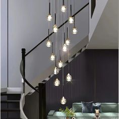 Dazzle Your Home with This Crystal Cascade Chandelier Nordic Staircase, Pendant Staircase, Staircase Chandelier Modern, Living Room Elevation, Cascading Waterfall, Long Chandelier, Staircase Makeover, Staircase Decor, Lampshade Designs