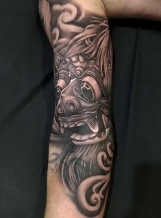 a person with a tattoo on their arm