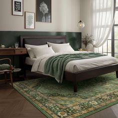 a bedroom with a large bed and green rug on the floor in front of a window