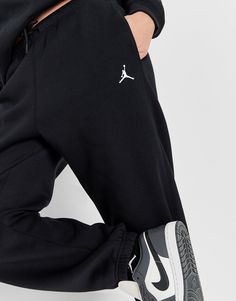 Rep the Jumpman on off-duty days with these women's Brooklyn Joggers from Jordan. In a Black colourway, these relaxed-fit pants are made from soft cotton fleece fabric with smooth outer and a brushed inner. They feature an elastic waistband with a drawstring for a custom fit, as well as cuffed ankles to show off your kicks. With side pockets for your essentials, these joggers are finished up with the legendary Jordan Jumpman logo to the thigh. Machine washbale. | Our model is 5'8.5" and wears a size small._ Black Jordans, Jumpman Logo, Jd Sports, Cotton Fleece, Off Duty, Workout Pants, Fleece Fabric, Custom Fit, Brooklyn