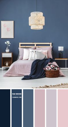 a bedroom with blue walls and pink bedding