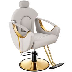 a white chair with gold trimmings and a cell phone on the table next to it