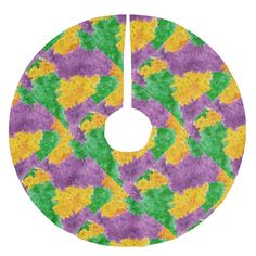 a colorful circular design with yellow, green and purple flowers