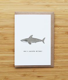 a card with a drawing of a shark on it