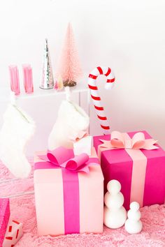 pink presents with candy canes and christmas decorations