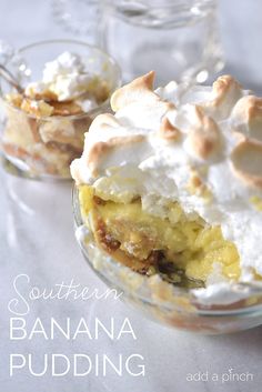 banana pudding with whipped cream and nuts in a glass dish on a white tablecloth