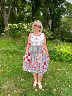 Strawberry Garden" This loose-fitting dress is made from a vintage handmade quilt top with floral feedsack material. The hand- embroidered bodice features a lady with a beautiful gown twirling in her flower garden. There is additional flower embroidery on the back bodice as well.   This beautiful hand- embroidered, one of a kind dress  is sure to make you feel  good. The sleeveless style(with deep side-seam pockets) is perfect on hot summer days or with a cardi for cooler weather.  Flat Measurements (Be sure to double!) are: Pit to Pit -20" Empire Waist 20" Shoulder to Empire waist 13.5" Shoulder to hem 41" This dress is made from once treasured vintage fabrics that were no longer being used. Recycling them into clothing gives the fabrics a new life and you a chance to wear one-of-a-kind, Folk Style Cotton Patchwork Dresses, Multicolor Floral Patchwork Dress For Daywear, Multicolor Upcycled Dresses For Spring, Summer Folk Dress With Patchwork, Strawberry Garden, Embroidered Bodice, Garden Dress, Fitting Dress, Antique Fabrics