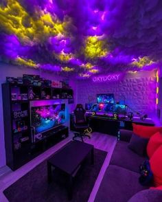 a living room filled with furniture and purple lighting on the ceiling above it is a fish tank