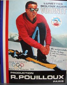 an advertisement for the winter olympics featuring a man in red jacket and sunglasses on skis