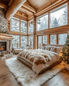 a bedroom with a fireplace and large windows