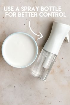 a bottle of milk next to a bowl with a toothbrush on it and the words use a spray bottle for better control