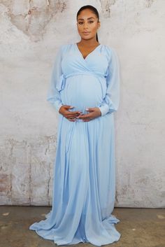 Size Guide Leanne has a gracious and stylish air about her, and will have you looking like the bell of the ball. Perfect for a baby shower, pregnant wedding guest or pregnancy photoshoot. The Leanne gown is flowy and vibrant, featuring sheer bell sleeves and tied waist belt. Available in sizes upto 3XL White Baby Shower Dresses, Aqua Dress Outfit, Light Blue Maternity Dress, Wrap Gowns, Royal Blue Maternity Dress, Blue Baby Shower Dress, Future Pictures, Lace Maternity Gown, Pink Maternity Dress