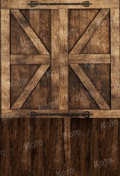 an old wooden door with iron bars on the side and wood paneling behind it