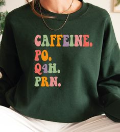 a woman wearing a sweatshirt that says caffeine po ah prn