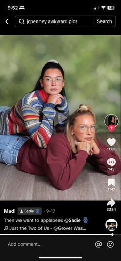 two women are laying on the floor with their heads turned to look like they're looking at each other