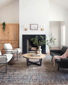 a living room filled with furniture and a fire place