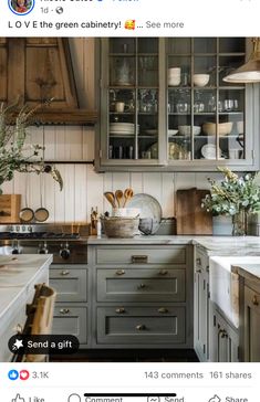 the kitchen is decorated in shades of gray and white, with lots of greenery