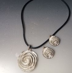 Silver Rose Pendant On A Black Cord Necklace Adjustable With Matching Pierced Rose Earrings Set. 16in To 18in New Without Tags New To Poshmark? Use This Code Tobyoshi 1028 For $10 Dollars Off Your First Purchase In Any Closet! Buy Now Before This Offer Expires .Tobyoshi 1028 For Free $10 Off Silver Necklace With Rose Design, Adjustable Rose Sterling Silver Jewelry, Adjustable Sterling Silver Jewelry In Rose Color, Silver Metal Necklace With Rose Design, Silver Rose Design Metal Necklace, Silver Rose Design Necklace, Silver Metal Jewelry With Rose Design, Black Cord Necklace, 10 Dollars