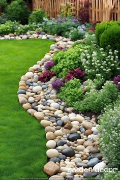 a garden filled with lots of rocks and flowers