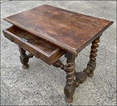 an old wooden desk with two drawers on the bottom and one drawer at the top