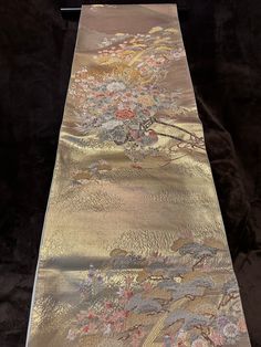 Free shipping Vintage Japanese Obi (Kimono sash), 100%silk, Shinning Gold base, High-density Embroidery 05-0014 On this Obi, the colors are tender, yet it looks gorgeous with tenderly shining gold.   The atmosphere of this Obi is gorgeous but at the same time calm because we don't feel self-assertive from this Obi.  Please appreciate Japanese elegance and chicness having this obi in your hands. We offer a set of a hanger and a pair of weights for Obi hanging decoration for a set price.  Please see below for ** Set of Obi Decoration Hunger and Weights, and item No.03-0100 for photos of the set.        Fukuro-Obi (One side pattern) Rokutsu- Gara ( Main pattern on approximately 60% of the front side ) Back side (another silk fabric) - ivory plain Appro.40% of front side - ivory plain width 30 Traditional Silk Scarf For Formal Occasions, Traditional Gold Ceremonial Kimono, Traditional Formal Silk Scarf, Japanese Elegance, Obi One, Obi Kimono, Belt Kimono, Japanese Obi, Japanese Colors