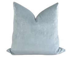 a light blue pillow on a white background