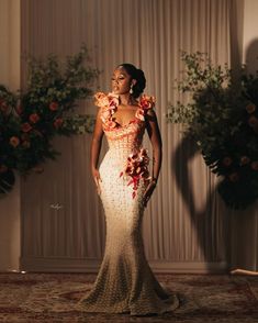 a woman in a dress with flowers on it