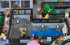 lego people are gathered around in a building