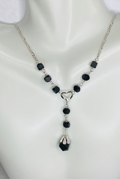 Beautiful figaro link necklace featuring genuine Azabache Jet gemstones. The Azabache Jet gemstones are 5mm. Necklace length is 18" and it features a spring ring clasp. There is a heart charm accent and an additional Azabache Jet bead hanging from it, which measures 7mm. Weight of the necklace is 4.10 grams. Jet Black Heart, Grunge Accessories, Pretty Jewelry Necklaces, Necklace Ideas, Black Bead Necklace, Pretty Jewelry, Valentines Jewelry, Gothic Jewelry, Jewelry Inspo