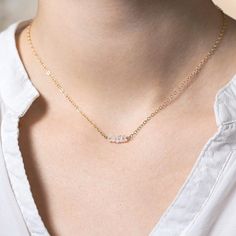 A row of sparkling moonstone gemstones on a delicate chain. Minimal and pretty, wear alone or layered with longer necklaces. Available with 14k gold fill, 14k rose gold fill and sterling silver chain. + Features genuine faceted moonstones. + 14k gold fill / 14k rose gold fill /sterling silver chain. + Beautifully packaged in a Minetta box ready for gift giving. About Gold Fill: 14k gold filled jewellery has 100+ times more gold than gold plated. Composed of a solid layer of gold bonded with heat Moonstone Gemstones, Gemstone Bar Necklace, Initial Disc Necklace, Vertical Bar Necklace, Necklace Birthstone, Gold Bond, Gold Bar Necklace, Moonstone Beads, Delicate Chain