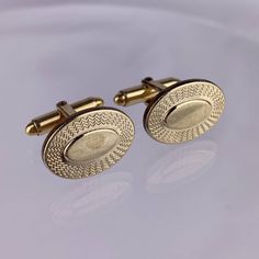 "Vintage Kreisler oval 14k yellow rolled gold overlay cufflinks. Measures approximately 1/2\" x 7/8\" long. Overall good condition. May have scuffs, scratches, and/or wear to the finish, corrosion spots, or other finish imperfections. See photos for more details." Classic Oval Jewelry For Formal Occasions, Classic Oval Cufflinks For Anniversary, Antique Round Cufflinks For Formal Occasions, Classic Yellow Gold Oval Cufflinks, Oval Polished Cufflinks For Business, Classic Oval Yellow Gold Cufflinks, Oval Cufflinks For Business, Gold Round Cufflinks With Screw Back, Oval Yellow Gold Cufflinks For Gift