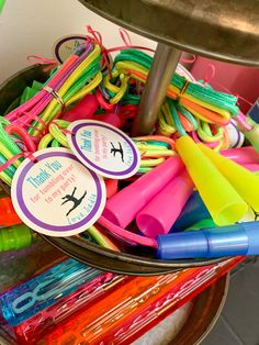 a basket filled with lots of different colored markers and markers on top of each other