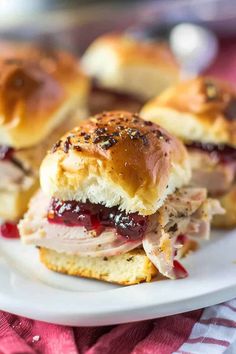 ham and jelly sliders on a white plate