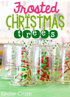 christmas trees made out of plastic cups on a table with text overlay that reads frosted christmas trees