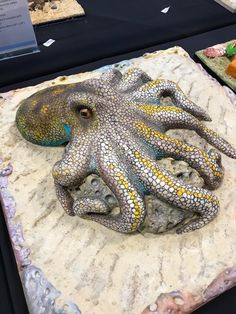 an octopus sculpture sitting on top of a table