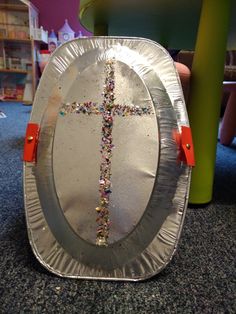 a paper plate with a cross on it