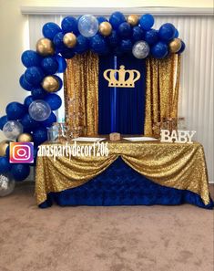 a blue and gold baby shower is set up in the middle of a carpeted room