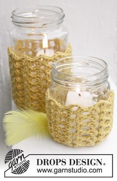 crocheted mason jars with candles in them on a white tablecloth and text that says drops design