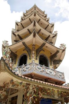 a tall building with ornate designs on it's sides