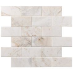 a white marble tile wall that looks like it's made out of tiles