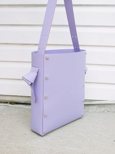 DESCRIPTION: Our minimal leather bucket AEHEE Tote Bag features an adjustable strap that can be carried on the shoulder, crossbody, and top handle bag. This bag fits a 14" laptop, magazine, and daily essentials. This classic tote has a hand-knotted strap and an inside slip pocket. Minimal leather bucket tote bag details: COLOR: ﻿Lavender DIMENSION: 11"W x 13"H x 3"D Strap: 19" ~ 43" (adjustable) MATERIALS: Certified Italian Full grain Vegetable-tanned leather Hardware: High-quality rivets from Italy Product Characteristics   AÉHEE NEW YORK accessories are meticulously crafted by hand using vegetable-tanned leather, combined with high quality hardware. Each piece is unique in nature, with possible small imperfections in the leather or hardware considered part of its character rather than de Bucket Tote Bag, Bucket Tote, Bag Details, Leather Hardware, Gifts For New Mums, Leather Bucket, Mens Jewelry Bracelet, Daily Essentials, Fine Jewelry Gift