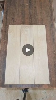 a wooden table top with a video player on it's side and the bottom part of the table being cut out