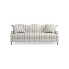 a striped couch sitting on top of a white floor