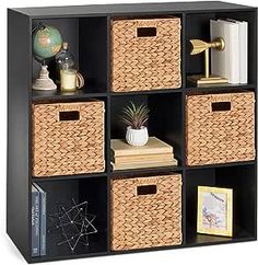 a shelf with baskets and books on it