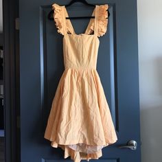 Really Cute Yellow/Orange Flouncy Tie Back Dress. Nwt. Size Medium. Orange A-line Dress For Brunch, Orange A-line Dress For Daywear, Orange Cotton Sundress For Brunch, Orange Sundress For Spring Brunch, Spring Orange Sundress For Daywear, Tie Back Dress, Orange Tie, Back Dress, Yellow Orange