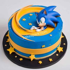 a blue and yellow sonic cake with stars on it